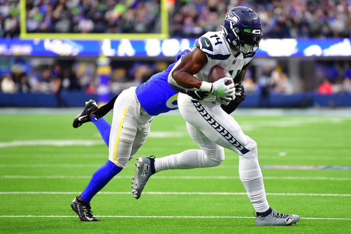 Seattle Seahawks wide receiver DK Metcalf (14) runs the ball against Los Angeles Rams cornerback Derion Kendrick (6) during the second half at SoFi Stadium.